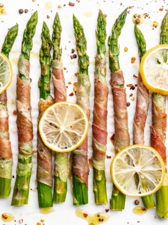 Crispy prosciutto wrapped around fresh green asparagus fresh from the oven