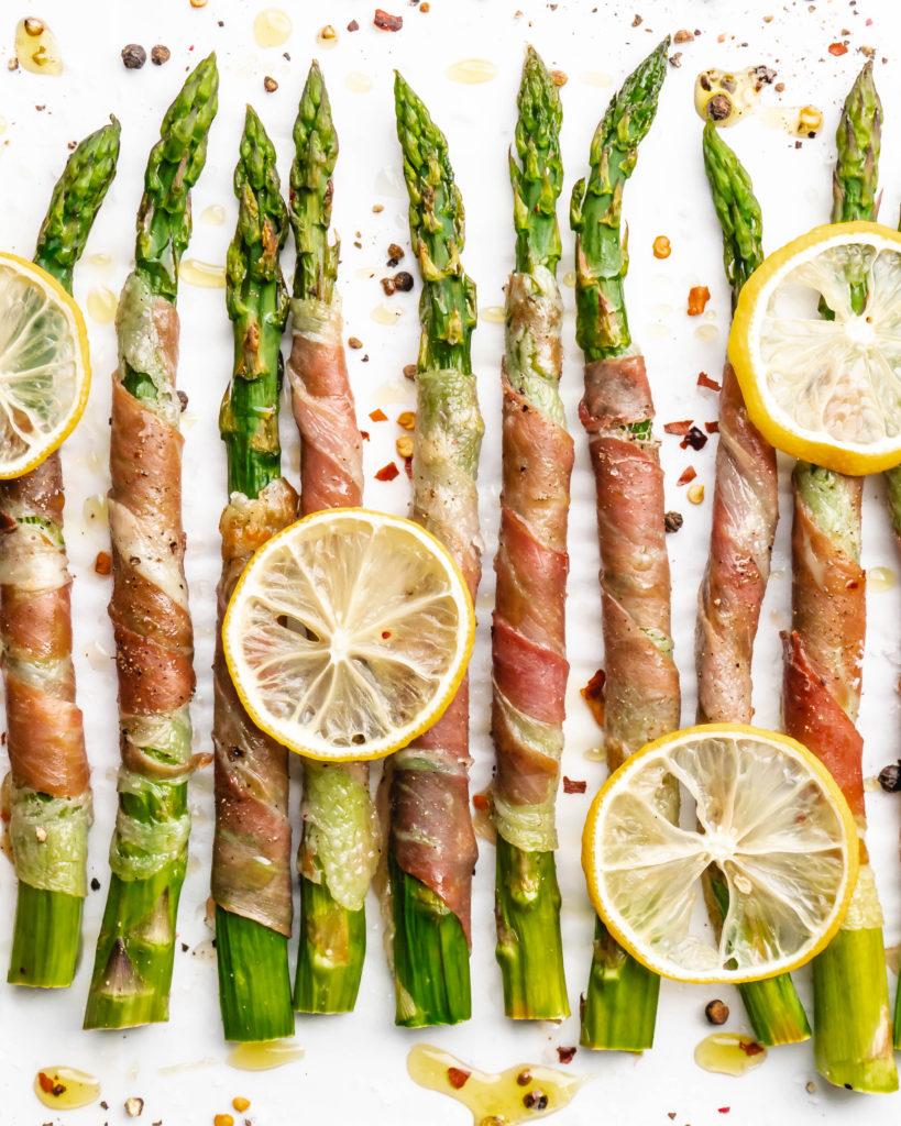 Crispy prosciutto wrapped around fresh green asparagus fresh from the oven