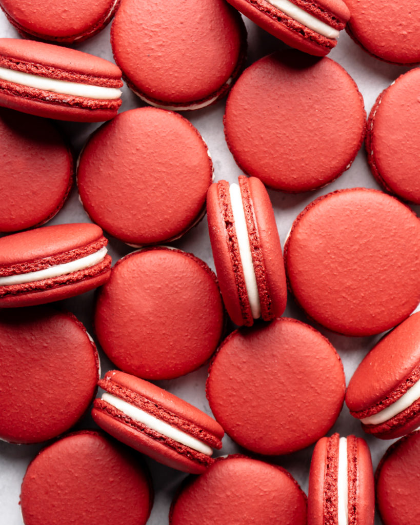 Red Velvet Macarons, filled with cream cheese frosting, ready to be eaten