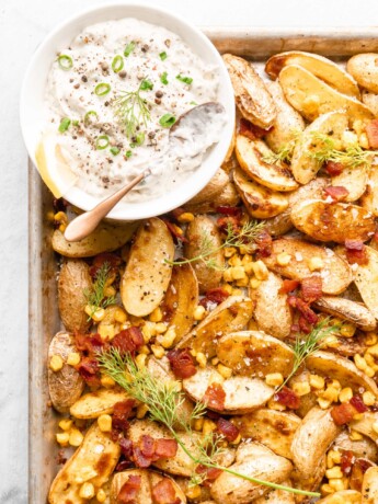 Roasted warm potatoes, corn, and bacon, ready to be dressed with the lemon and dill based dressing