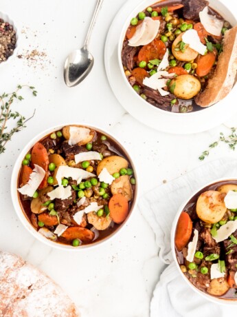 Melt in your mouth pieces of chuck steak, vibrant thick cut carrots, buttery baby potatoes, and brightly flavored peas are braised in a red wine liquid to create a delicious and hearty beef stew