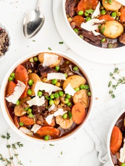 Melt in your mouth pieces of chuck steak, vibrant thick cut carrots, buttery baby potatoes, and brightly flavored peas are braised in a red wine liquid to create a delicious and hearty beef stew