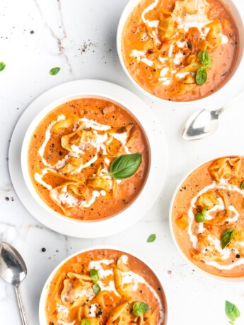 This Creamy Tomato and Tortellini Soup is vibrant in color and full of flavor. Made with San Marzano tomatoes, cream, cheesy tortellini, and a touch of white wine.