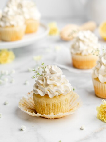 Fluffy and moist lemon cupcakes are frosted with a velvety and smooth elderflower Swiss Meringue Buttercream.