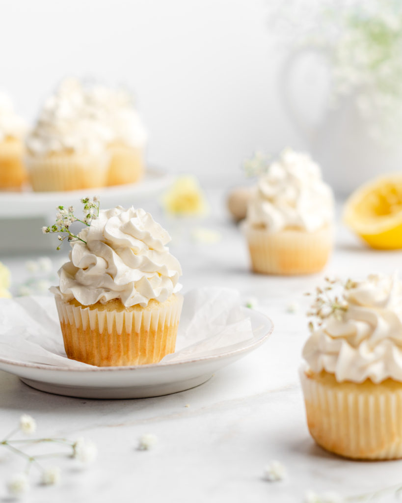 Fluffy and moist lemon cupcakes are frosted with a velvety and smooth elderflower Swiss Meringue Buttercream.