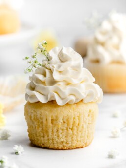 Fluffy and moist lemon cupcakes are frosted with a velvety and smooth elderflower Swiss Meringue Buttercream.