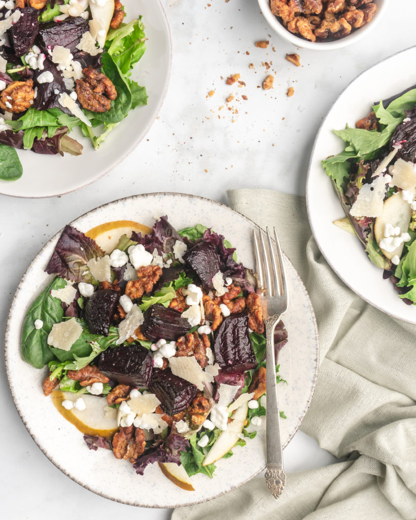 This delicious salad is made up on maple and brown sugar glazed beets, sliced crisp bosc pears, creamy tart goat cheese, shaved parmesan, and candied walnuts.