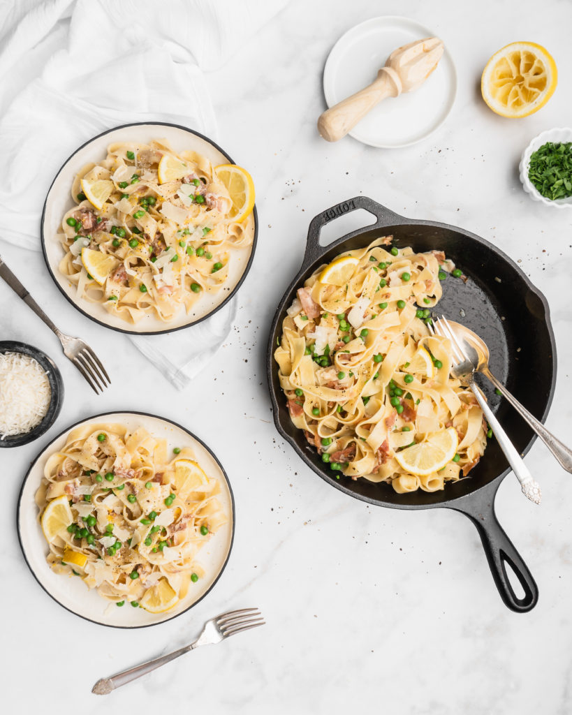 Prosciutto, cream, peas, and lemon come together to form the sauce that will cover the delicious ribbons of fettuccine.