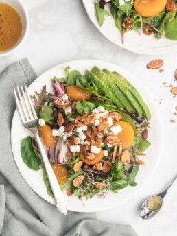 This delicious salad features spinach, spring mix, goat cheese, avocado, mandarins,and honey roasted almonds. Topped with a zippy champagne vinaigrette.