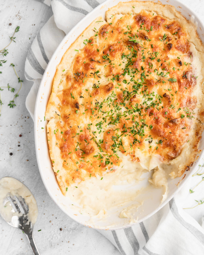 These mashed potatoes are creamy, fluffy, and cheesy! Made with horseradish, thyme-infused cream, and a bunch of cheese!