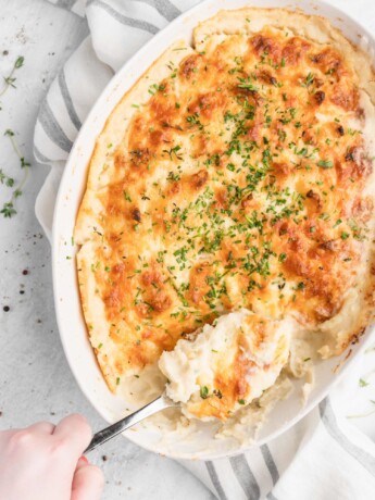 These mashed potatoes are creamy, fluffy, and cheesy! Made with horseradish, thyme-infused cream, and a bunch of cheese!