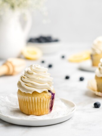 light and moist lemon cupcakes are speckled with little bursts of sweet fresh blueberries. Topped with a light and fresh lemon-infused mascarpone whipped cream