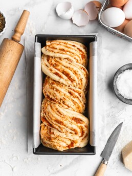 This braided Pizza bread features marinara, mozzarella, and parmesan as a filliing, which is then sliced and braided into the bread to create a artistic looking bread
