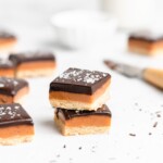 A buttery, rich shortbread layer is topped with a golden creamy caramel layer that is infused with vanilla beans an bourbon, which is further topped by a dark chocolate layer and flaky sea salt.