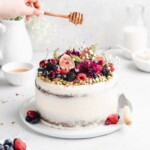 This Pistachio cake is styled in a semi-naked fashion with honey rosewater swiss meringue buttercream