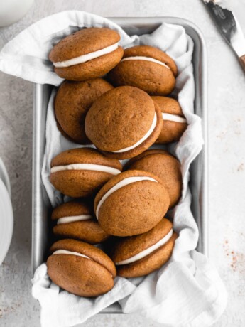 These Pumpkin Whoopie Pies feature Brown Butter Cream Cheese Filling is sandwiched between 2 fluffy pumpkin cookies