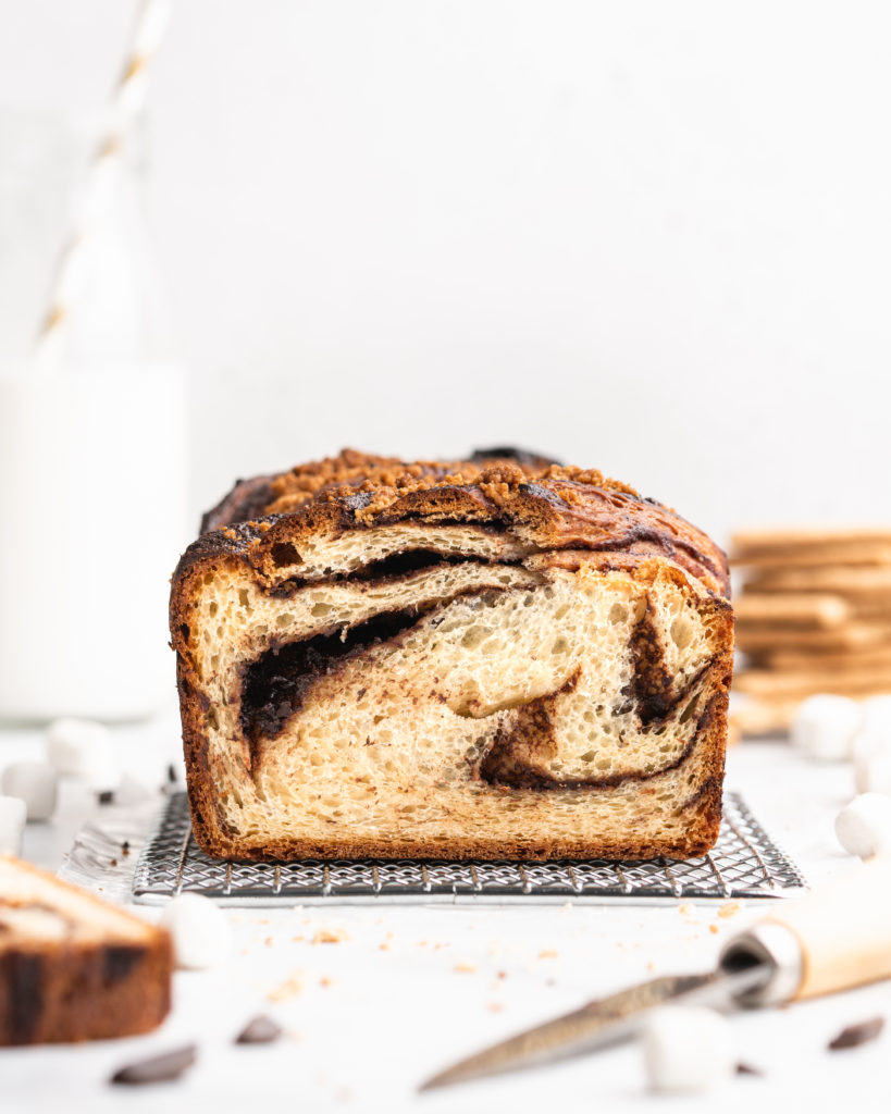 The beautiful babka loaf is filled with chocolate spread, crushed graham crackers, mini marshmallows, and topped with a graham cracker streusel