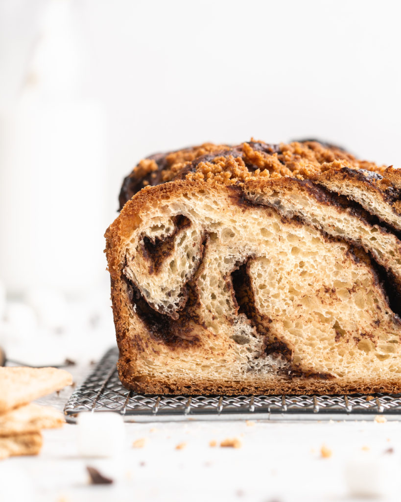 The beautiful babka loaf is filled with chocolate spread, crushed graham crackers, mini marshmallows, and topped with a graham cracker streusel