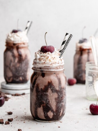 This creamy black forest milkshake features rich chocolate ice cream, sweet flavorful cherry jam, and a nice helping of whipped cream on top!