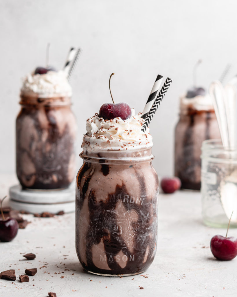 This creamy black forest milkshake features rich chocolate ice cream, sweet flavorful cherry jam, and a nice helping of whipped cream on top!