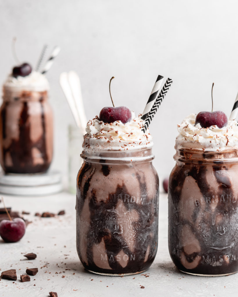 This creamy black forest milkshake features rich chocolate ice cream, sweet flavorful cherry jam, and a nice helping of whipped cream on top!