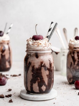 This creamy black forest milkshake features rich chocolate ice cream, sweet flavorful cherry jam, and a nice helping of whipped cream on top!