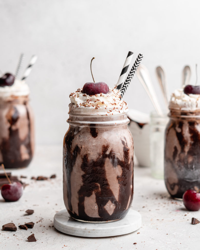 This creamy black forest milkshake features rich chocolate ice cream, sweet flavorful cherry jam, and a nice helping of whipped cream on top!