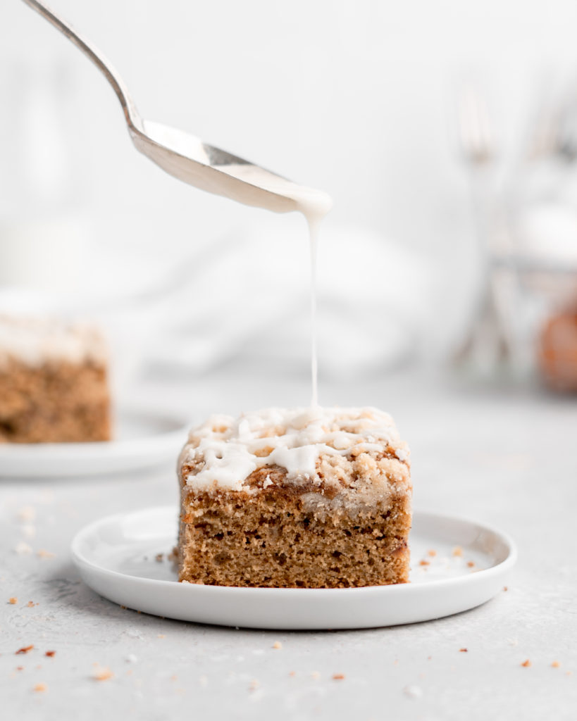 This Apple Cinnamon Spice Cake features a moist, perfectly-spiced cake that is speckled with apples and topped with a buttery streusel topping