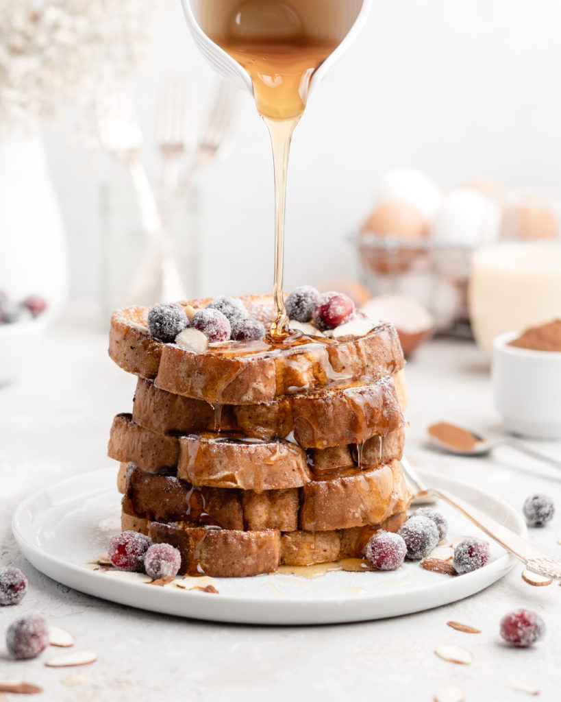 This delicious Christmas-themed French Toast is soaked in an eggnog custard and topped with a buttered maple bourbon syrup