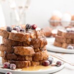 This delicious Christmas-themed French Toast is soaked in an eggnog custard and topped with a buttered maple bourbon syrup