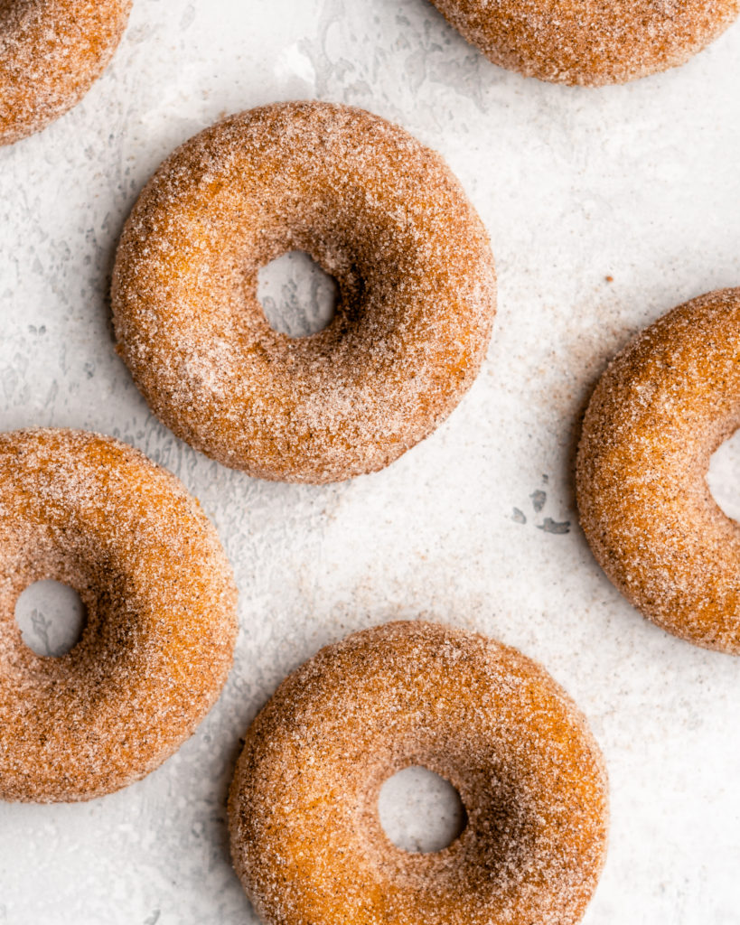 These easy to make Baked Pumpkin Donuts are covered in a cinnamon sugar coating.