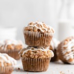 These moist banana muffins are topped with a buttery streusel topping and a simple creamy glaze!