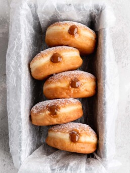 Filled with creamy, deeply sweet dulce de leche, these filled yeast donuts are crazy delicious