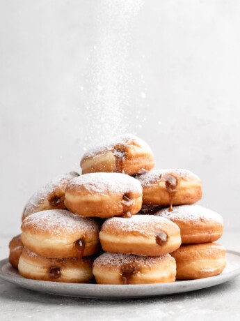 Filled with creamy, deeply sweet dulce de leche, these filled yeast donuts are crazy delicious