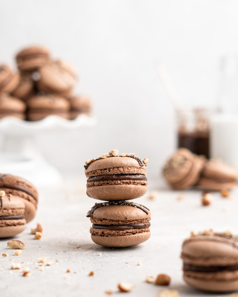 Chocolate macarons are filled with a delicious and easy to make Nutella Buttercream in these Nutella Macarons