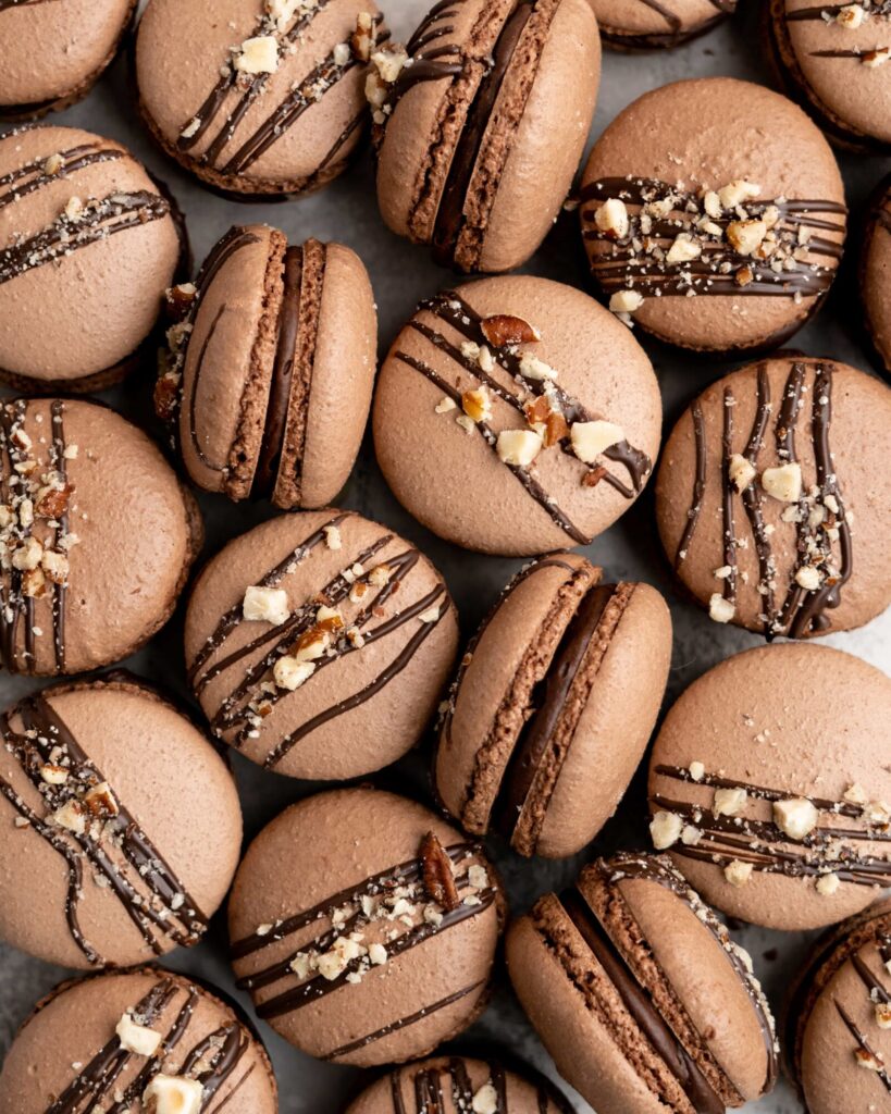 Chocolate macarons are filled with a delicious and easy to make Nutella Buttercream in these Nutella Macarons