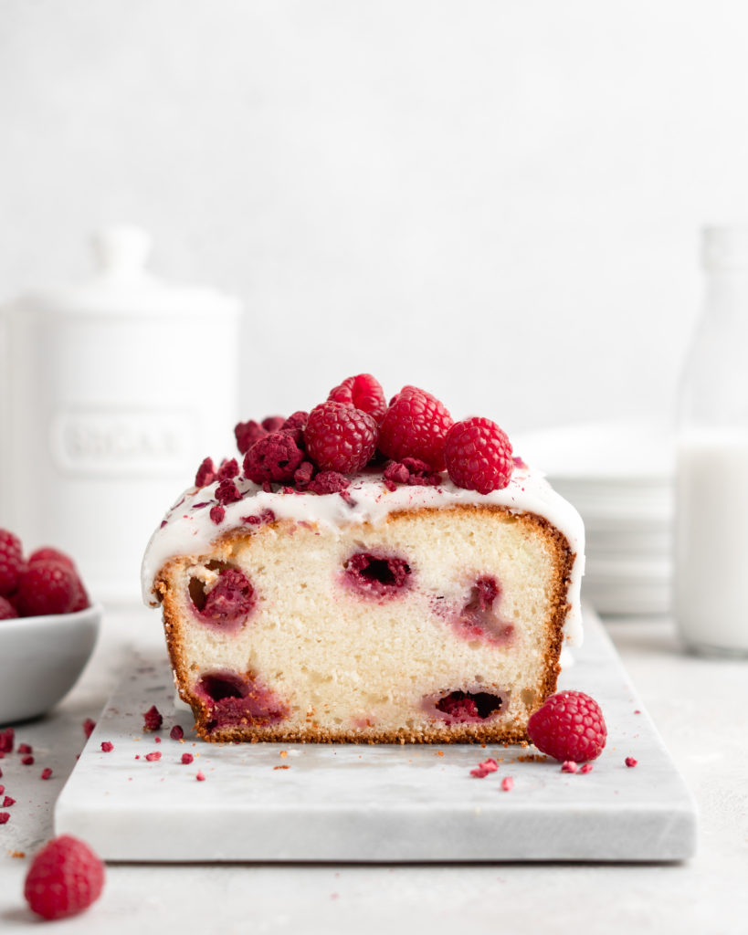 Loaf cake that is flavoured with rosewater and speckled with fresh raspberries. Glazed with a thick rosewater glaze