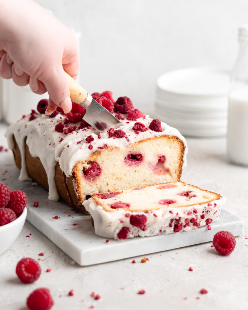 Loaf cake that is flavoured with rosewater and speckled with fresh raspberries. Glazed with a thick rosewater glaze