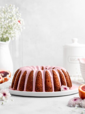 A pretty, golden Blood Orange Ricotta Bundt Cake is glazed with a creamy pink blood orange glaze