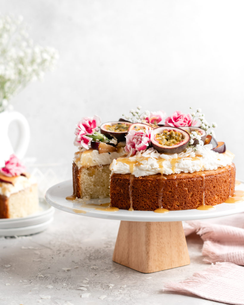 Moist, fluffy Triple Coconut Cake is topped with a creamy passion fruit caramel sauce