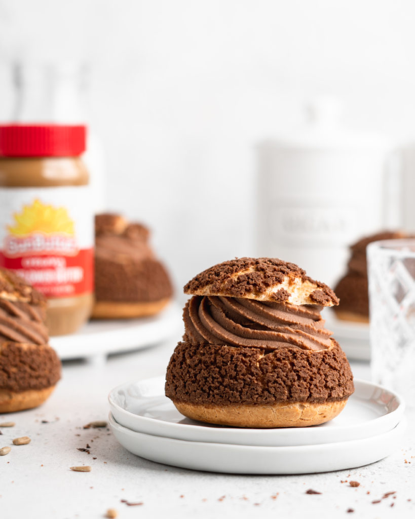 Cream puffs topped with a chocolate craquelin, filled with a creamy SunButter Milk Chocolate whipped ganache filling