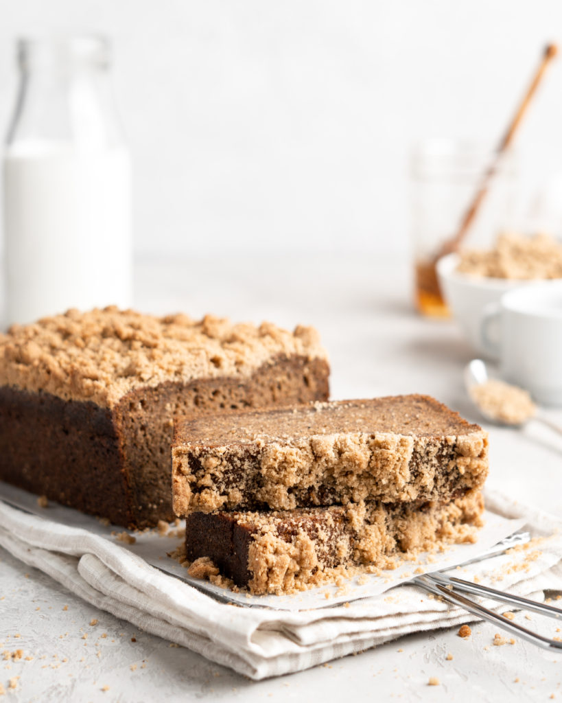Moist tender banana bread is spiced with chai tea and chai flavors and topped with a buttery streusel topping