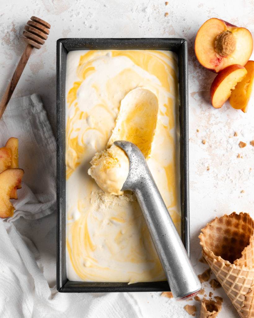 Homemade no churn salted honey and peach ice cream in a baking dish