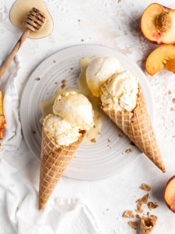 Homemade no churn salted honey and peach ice cream in 2 cones