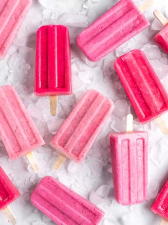 Bright pink popsicles are made with guava juice, dragon fruit (pitaya), greek yogurt, and agave.