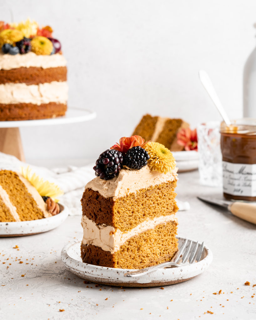 2 thick brown butter pumpkin cake layers are sandwiched together with dulce de leche russian buttercream