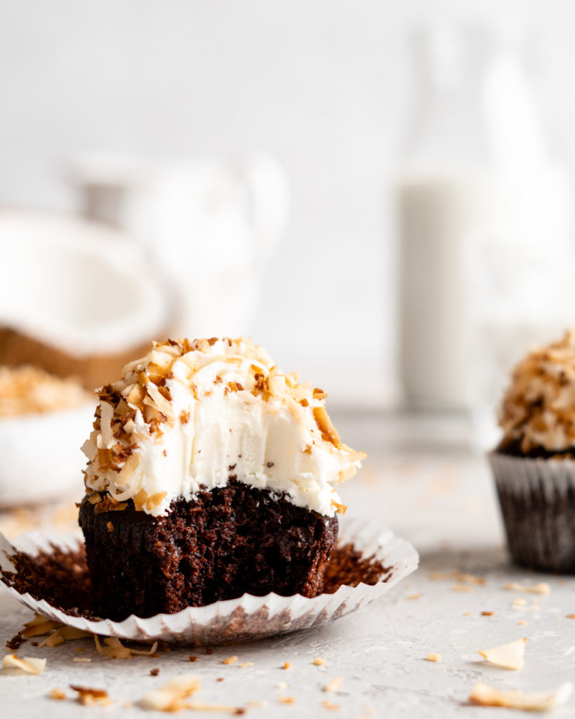Chocolate coconut cupcakes are topped with a creamy coconut frosting and toasted coconut