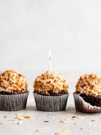 Chocolate coconut cupcakes are topped with a creamy coconut frosting and toasted coconut