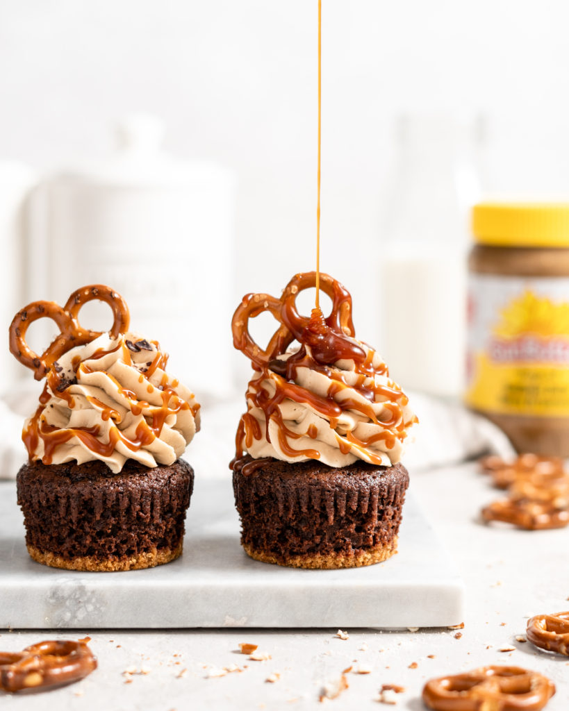 Chocolate Cupcake with Pretzel Crust and SunButter buttercream frosting. Topped with salted caramel