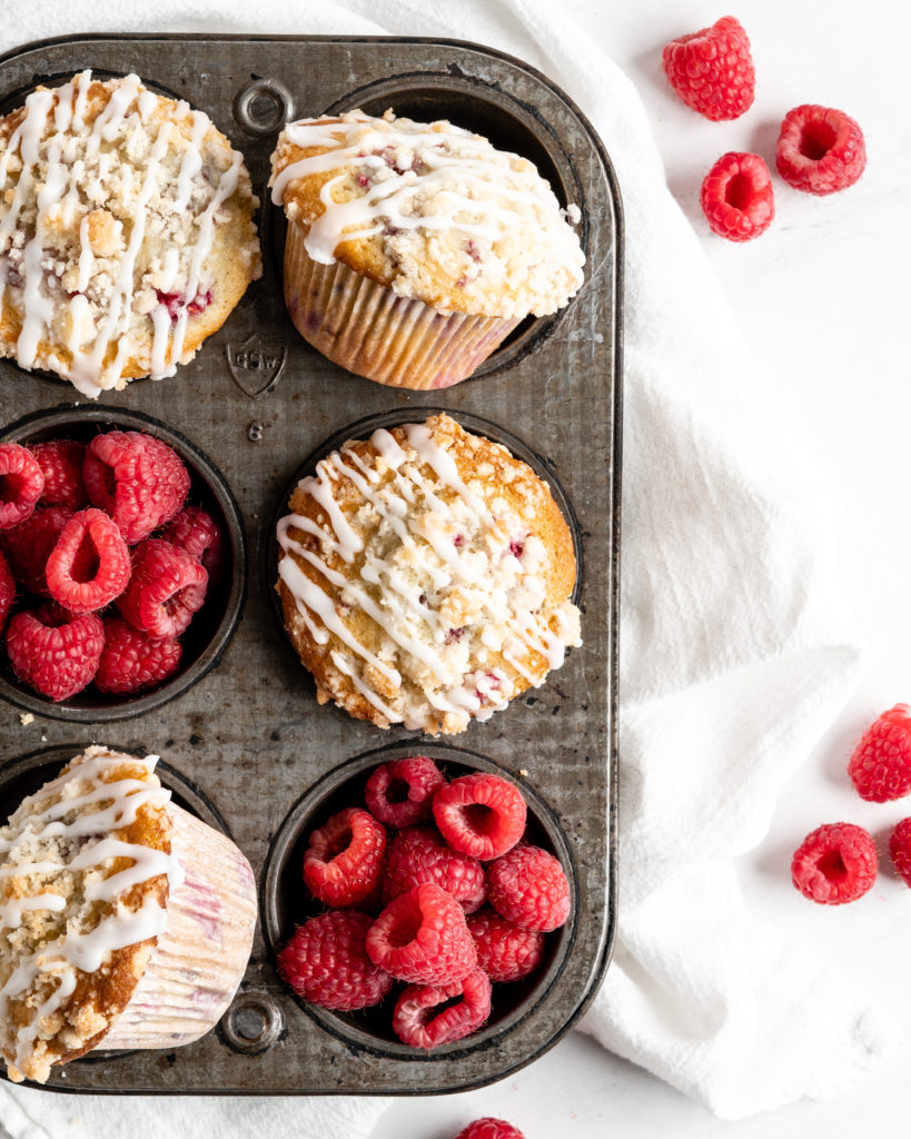 Fluffy and tall Buttermilk Raspberry Muffins with streusel topping